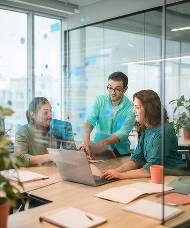 SaaS product team reviewing customer engagement charts in a modern office